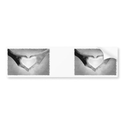 Black and white photo of a person's hands in the shape of a heart. Black and white photo of a person's hands in the shape of a heart.