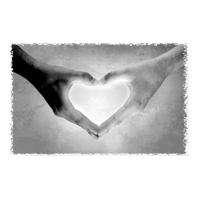 Black and white photo of a person's hands in the shape of a heart. Black and white photo of a person's hands in the shape of a heart.