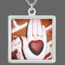 Heart in Hand necklaces