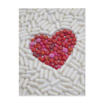 Heart made of red pills postcards