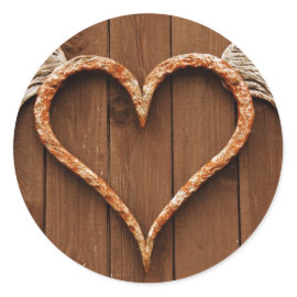 Heart with Wings Against Rustic Wooden Boards Round Sticker