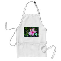 Hibiscus flower bright pink against green apron