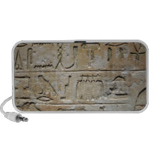 Hieroglyphics on a stone wall speaker system