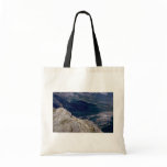 Hiker overlooking the Mountain River, NWT, Canada bags