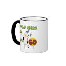 ringer_mug - Text reads "Holy Cow I'm 60" on 60th birthday T-shirts, mugs, cards, buttons, magnets, postage stamps, and other 60th birthday apparel and gifts with a cute cartoon cow in a party hat holding a birthday gift and birthday cupcake!