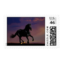 Horse silhouette galloping free at sunset postage stamp