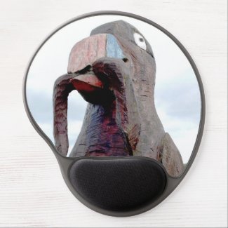 Early Birds Catch The Best Worms, a gel mousepad with a huge wooden bird and a worm in its beak.