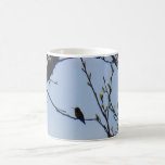 Hummingbird sitting on a tree mug