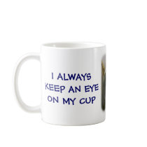 I ALWAYS KEEP AN EYE ON MY CUP mugs by knutstorvestre I ALWAYS KEEP AN EYE ON MY CUP mugs