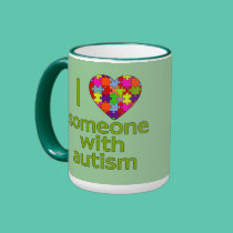 I LOVE SOMEONE WITH AUTISM mugs