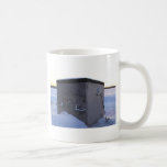 Ice fishing house at dusk. mug