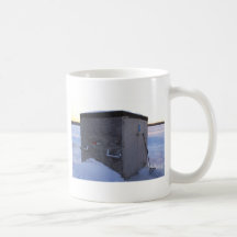 Ice fishing house at dusk. mug