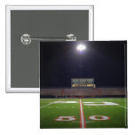 Illuminated American football field at night Buttons