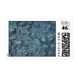 Illustrative Blue painted rock stucco postage