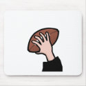 hand holding football