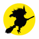 Black witch silhouette against golden full moon