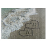 Interlocking Hearts on Beach Sand
