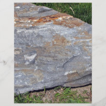 Isolated Rock with Red Patches Lying on Grassy Lan Personalized Flyer