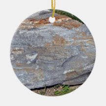 Isolated Rock with Red Patches Lying on Grassy Lan Ornament