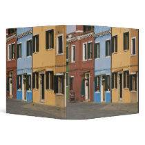 Italy, Burano. Colorful row of homes and empty Binders