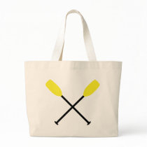 kayak paddles crossed bags
