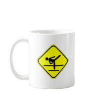 kicking sign coffee mug