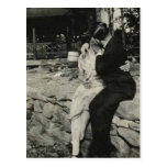 Kissing on the stone wall post card