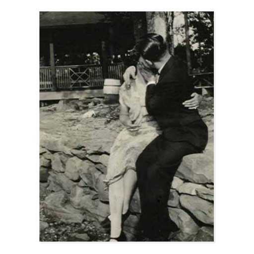 Kissing on the stone wall post card