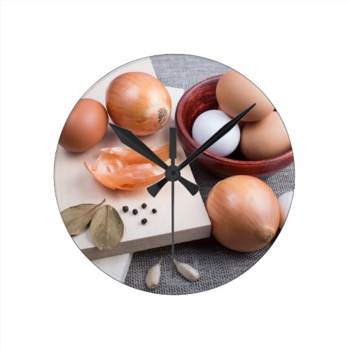 Kitchen table with raw food ingredients round clock Kitchen table with raw food ingredients round clock