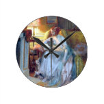 Lady reading by lamp round wall clock