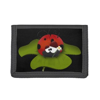 Ladybug on a green leaf wallets