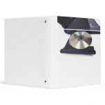 laptop computer with open optical disk drive, cd, binders