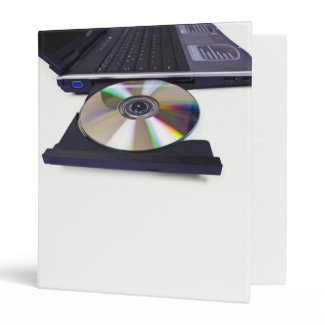 laptop computer with open optical disk drive, cd, vinyl binders