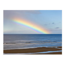 Large rainbow over the Pacific Ocean at Postcard