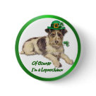round_button - This adorable little dog is wearing a green hat with gold buckle and shamrock accent. He holds a shamrock stem in his mouth and the text says ... Of Course Im a Leprechaun. Many matching gifts available in my store with this design.: Sizes 