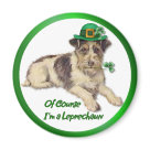 round_magnet - This adorable little dog is wearing a green hat with gold buckle and shamrock accent. He holds a shamrock stem in his mouth and the text says ... Of Course Im a Leprechaun. Many matching gifts available in my store with this design.: Sizes 