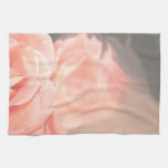 Light pink rose reflection in silver kitchen towel