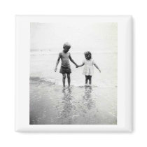 Little boy and girl holding hands magnets