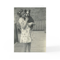 Little girl holding her dog greeting card