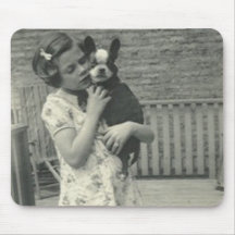 Little girl holding her dog mouse pads