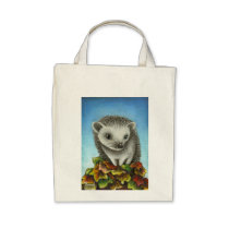 Little hedgehog on a big pile of leaves bags