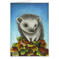 Little hedgehog on a big pile of leaves cards