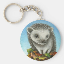 Little hedgehog on a big pile of leaves keychains