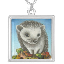 Little hedgehog on a big pile of leaves necklaces