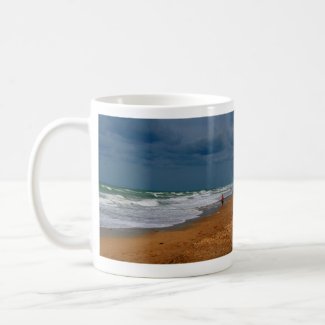 Lone Man Walking on Stormy Beach mug
