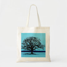 Lonely Tree in a Winter Landscape Canvas Bags