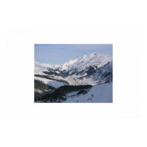 Looking down over a small alpine village posters