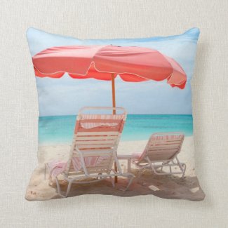 Lounge chairs on the ocean beach pillow