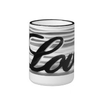 Love sign with white light streaks behind mugs