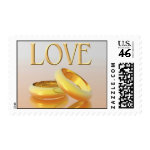 Love wedding postage stamps with gold rings